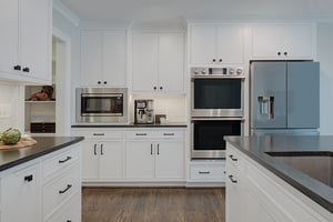 Denny and Gardner kitchen remodel with custom white cabinets and high end appliances