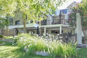 Exterior view of sunroom addition remodel by Denny + Gardner