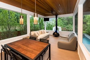 Interior of porch addition with fireplace by Denny + Gardner