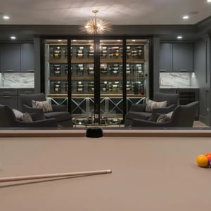 Pool table walk-in wine room basement renovation by Denny and GArdner